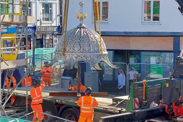 Contractors dismantle fountain before it goes into storage