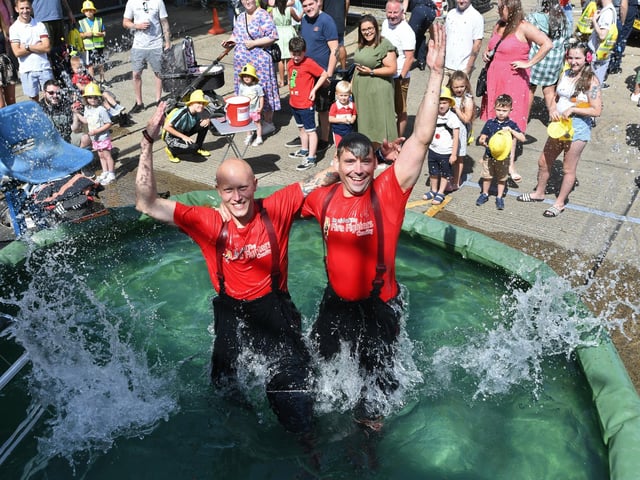 On the dunking stool, Callum Hodgkin and Tom Bishop.