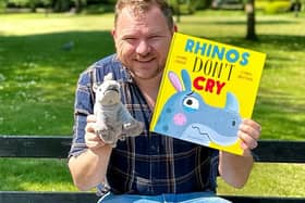 Mark with his new book, Rhinos don't cry. Photo: Mark Grist