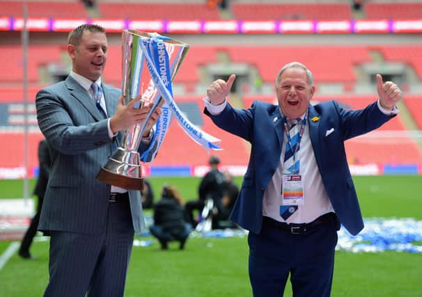 Peterborough United chairman Darragh MacAnthony and Director of Football Barry Fry celebrate after the Johnstone's Paint Final win over Chesterfield.