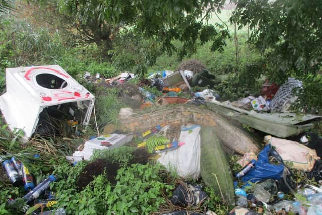 Household appliances and mattresses among the rubbish dumped by repeated fly-tippers at Coldham Bank