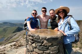 Sophie Antonucci (right) and the three members of her team who summitted Mount Snowdon three times in one day