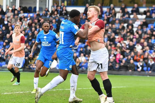 Kwame Poku in a scuffle during the Posh v Pompey match. Photo David Lowndes.
