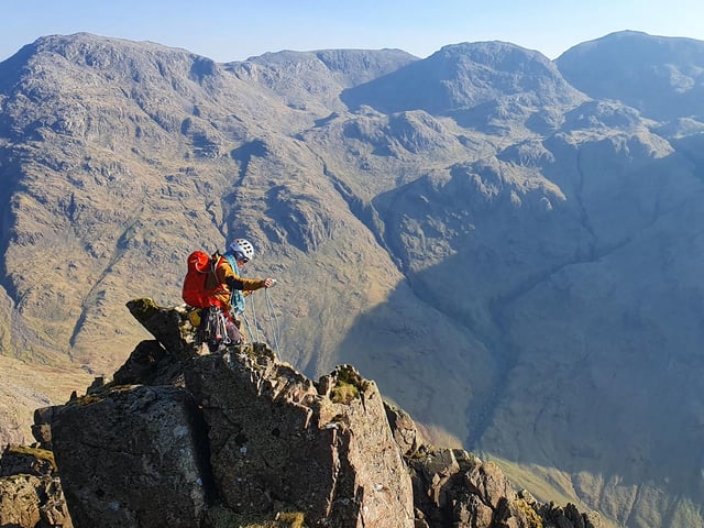 Mark Peck coiling the rope after climbing Napes Needle and Needle Ridge (Lake District)