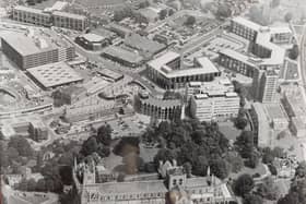An aerial shot of Peterborough Cathedral - with the Passport Office, 12-storey Cumberland House and the old market and multi-storey car park visible.