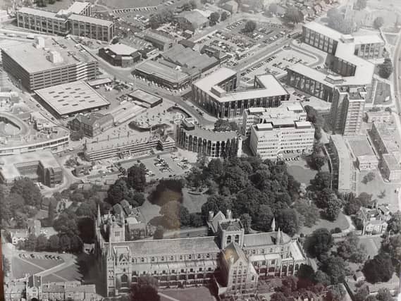 An aerial shot of Peterborough Cathedral - with the Passport Office, 12-storey Cumberland House and the old market and multi-storey car park visible.