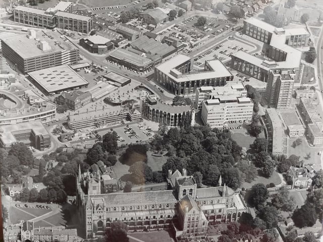 An aerial shot of Peterborough Cathedral - with the Passport Office, 12-storey Cumberland House and the old market and multi-storey car park visible.