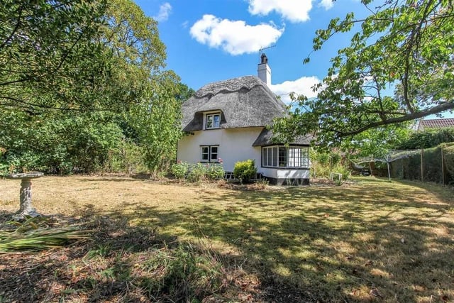 Grade II listed part-thatched cottage for sale in the pretty village of Conington