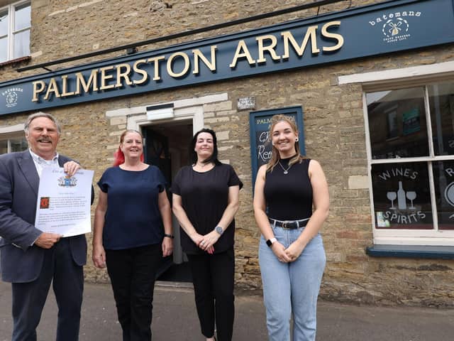 Councillor Alan Dowson (left) and landlady Gwyn Roberts (second left) with staff members Catherine Jaggard and Ashley Dalgettie at the re-opening of The Palmerston Arms on Oundle Road.