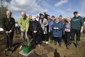 Mayor of Peterborough Nick Sandford and Mayoress Bella Saltmarsh with volunteers planting trees at a Tiny Forest at Hallfields Lane, Paston.