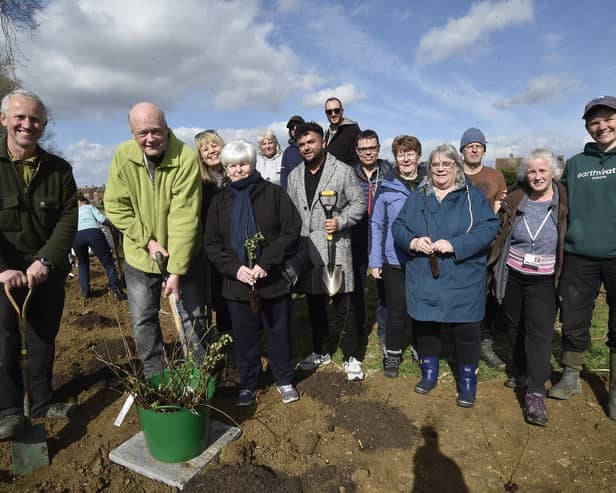 Mayor of Peterborough Nick Sandford and Mayoress Bella Saltmarsh with volunteers planting trees at a Tiny Forest at Hallfields Lane, Paston.