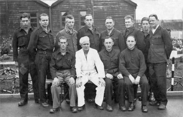 A picture postcard from Prisoner of War Camp #279, a Second World War working camp for German Prisoners of War (POWs)who worked as labourers in the local area. During the days immediately following the Dunkirk Evacuation in 1940, the camp was in Allied use and was very busy as a base for the 401/219 Company, Royal Engineers amongst others. As the war progressed, the camp was modified to hold German POWs (although records also show it also housed Poles, Ukrainians, Yugoslavs, Italians, one Russian and even a small number of British subjects). The camp buildings have long since been removed but the extensive concrete foundations can still be seen today on the opposite side of the A15 to the Ferndale estate.
