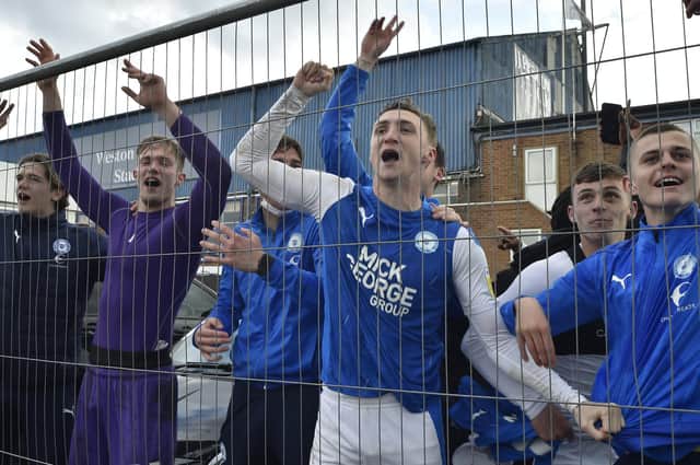 Posh midfielder Jack Taylor celebrates promotion from League One in 2021.