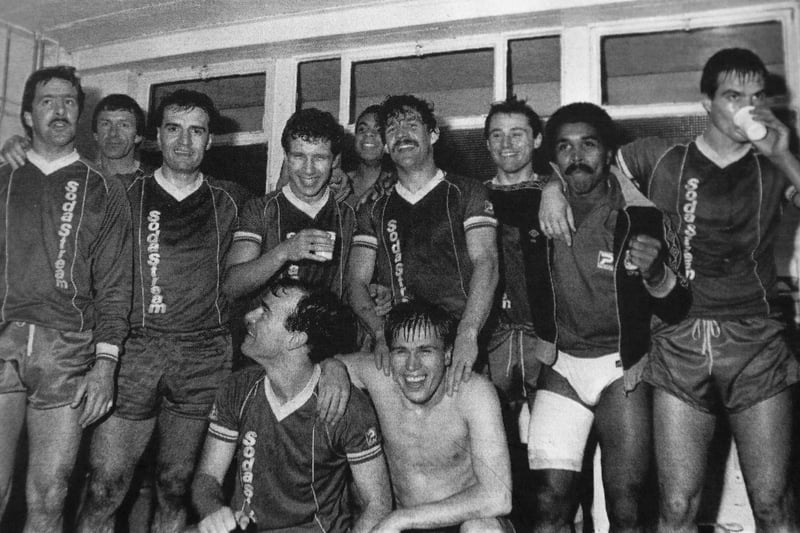 The Posh players celebrate their third round FA Cup win over Leeds United in 1986. The Posh squad was John Turner, Alan Paris, Martin Pike, Francis Cassidy, John Wile, Trevor Slack, Andy Kowalski, Lil Fuccillo, Greig Shepherd, Errington Kelly, Jackie Gallagher and Gary Worrall.