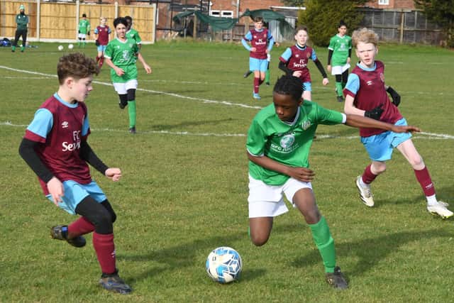 Action from FC Peterborough (gree) v Deeping Rangers in Under 13 Division Three of the Junior Alliance League.  Photo: David Lowndes.