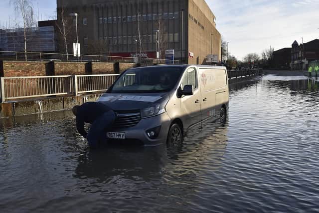 A van is stuck in flood water on Bourges Boulevard