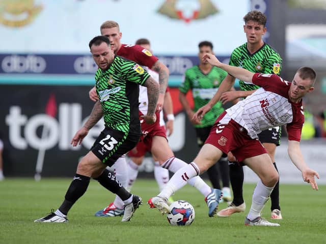 Lee Tomlin (left) in action for Doncaster at Northampton Town. Photo: Pete Norton Getty Images.