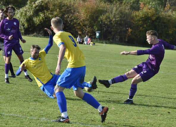 Action from Peterborough City v Sawtry (Yellow) at Ringwood. Photo: David Lowndes.