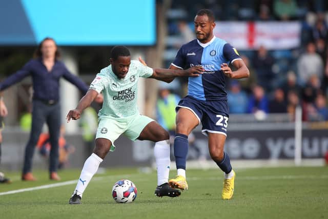 Jeando Fuchs of Peterborough United in action with Jordan Obita of Wycombe Wanderers. Photo: Joe Dent/theposh.com.
