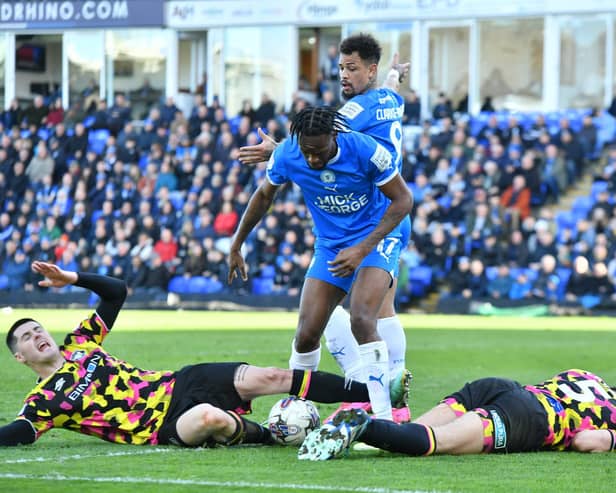 Carlisle United's defence is flat out after stopping Posh striker Ricky-Jade Jones. Photo David Lowndes.