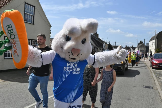Peterborough United mascot Peter Burrow join in the Yaxley Festival Parade through Main Street.