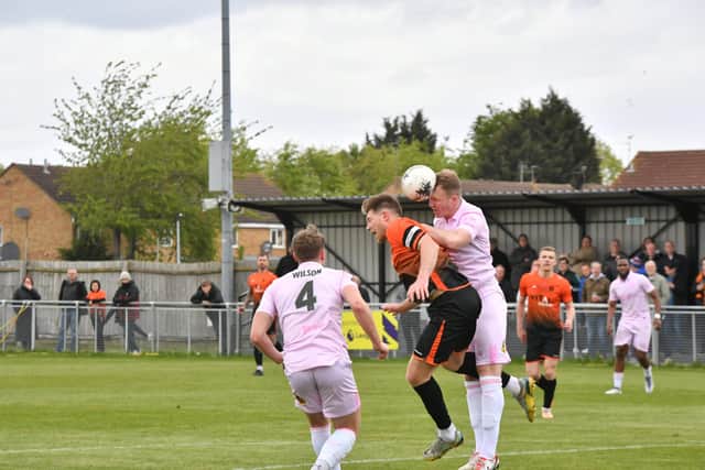 Mark Jones (orange) in action for Peterborough Sports v Chorley. Photo David Lowndes.