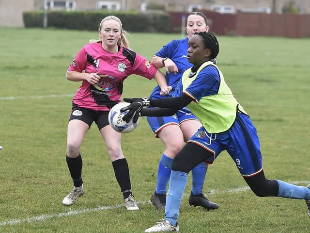 Action from ICA Sports (blue) and Girls United in the Cambs Girls Under 18 League. Photo: David Lowndes.