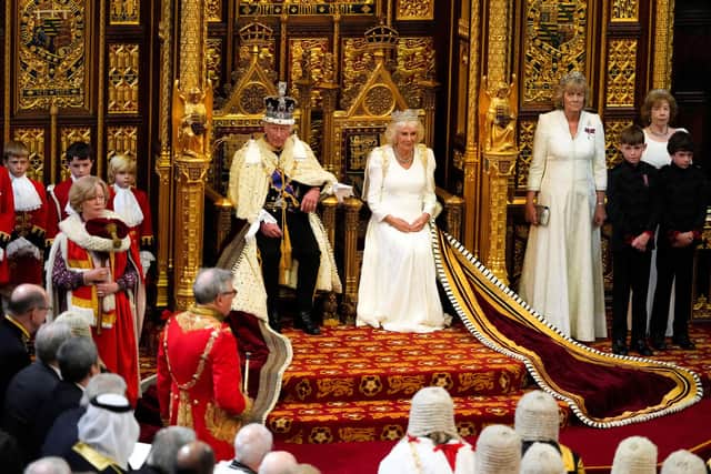 King Charles III sits alongside Queen Camilla as he prepares to read the King's Speech from the The Sovereign's Throne in the House of Lords chamber. (Getty Images)