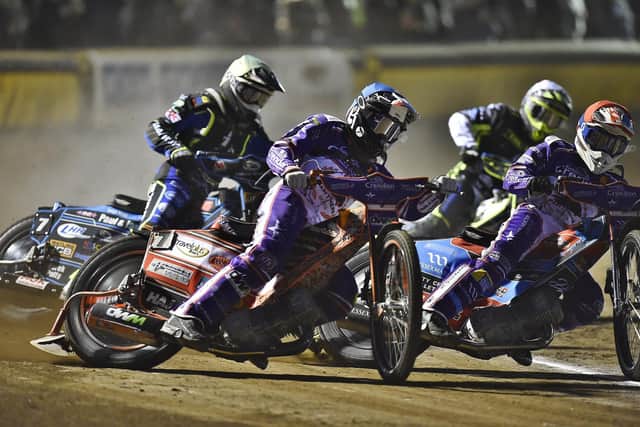 Heat 2 action from Panthers v Ipswich involving Ben Cook (red helmet) and Jordan Jenkins (blue).  Photo: David Lowndes.