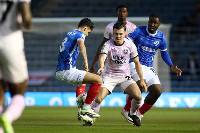 Charlie O'Connell of Peterborough United challenges for the ball against Portsmouth. Photo: Joe Dent/theposh.com.