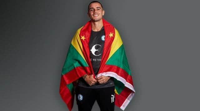 Oliver Norburn wrapped in the flag of Grenada. Photo: Joe Dent/theposh.com