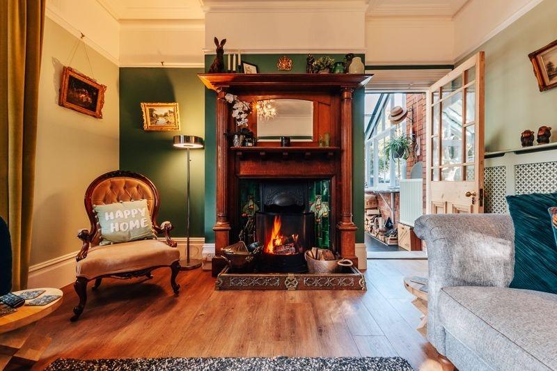 A view of the sitting room leading in to the conservatory