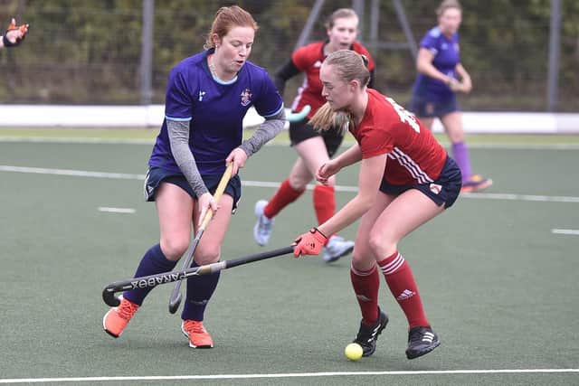 Action from City of Peterborough Ladies seconds (red) and Cambridge South. Photo: David Lowndes.