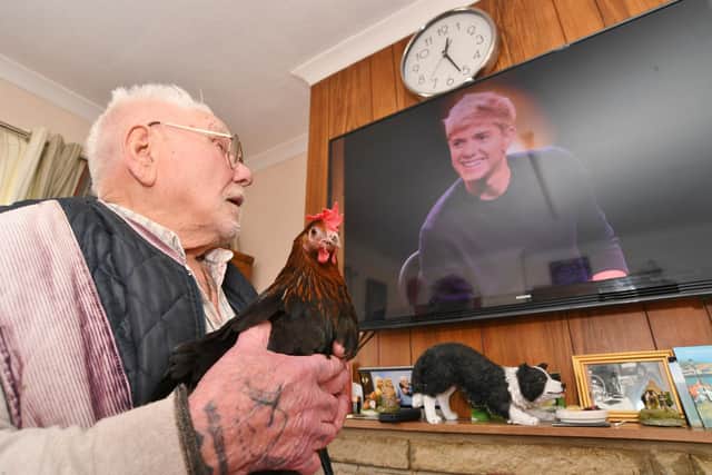 Gordon even watches TV with his two chickens (image: David Lowndes)