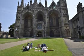 Sunbathers in the Cathedral Precincts during the warm weather