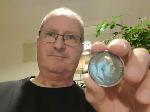 Metal detectorist David Anderson with the service medal of  ‘6131 Private T.H.Parker of the Northumberland Fusiliers.’