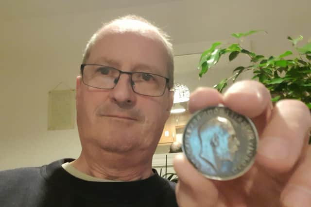 Metal detectorist David Anderson with the service medal of ‘6131 Private T.H.Parker of the Northumberland Fusiliers.’