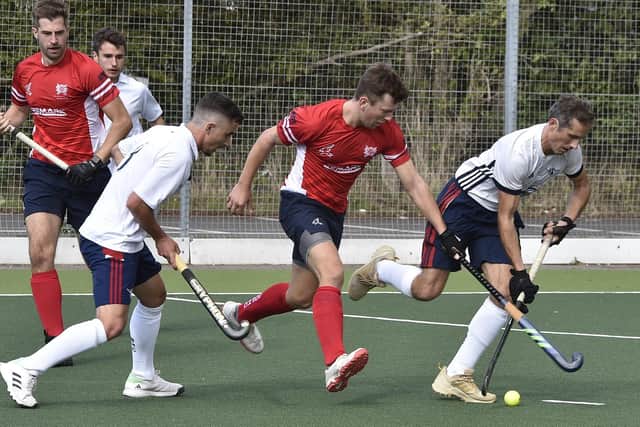Hockey action from City of Peterborough (red) v Banbury. Photo: David Lowndes.