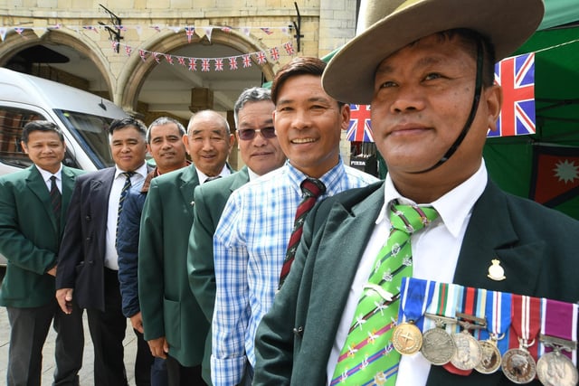 Manivaj Jolmi (right), President of the Gurkha Community in Peterborough with some of his members during the Armed Forces Day celebrations in Cathedral Square, Peterborough