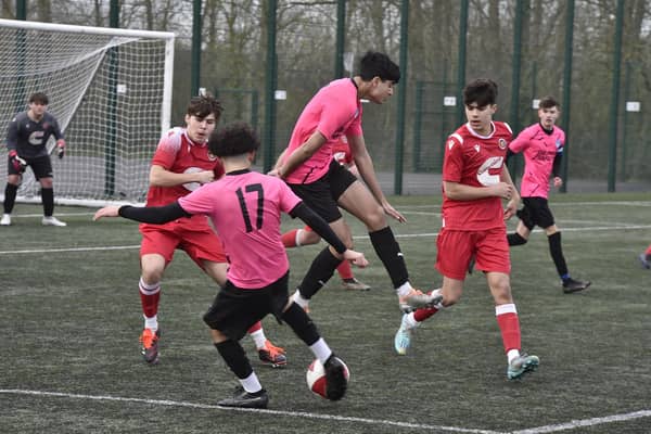 Action from Hampton Under 18s v Stamford (red). Photo David Lowndes.