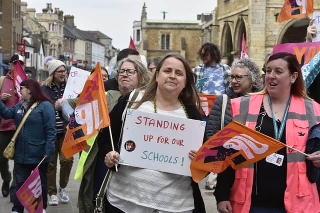 more than 30 teachers from across the city took to the streets in Peterborough this morning to walk from St Johns Church in the city centre to Sand Martin House.