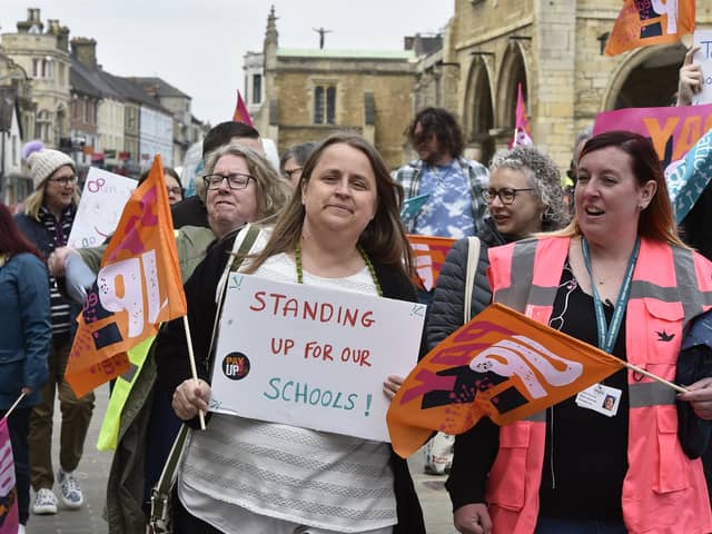 more than 30 teachers from across the city took to the streets in Peterborough this morning to walk from St Johns Church in the city centre to Sand Martin House.