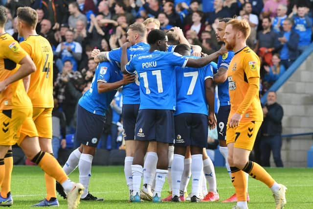 Posh celebrate victory over Cambridge United at the Weston Homes Sradium last season. Photo: David Lowndes.