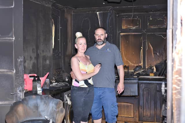 Eddie MacGregor and partner Esmerelda at their home at Collingham, Orton Goldhay - destroyed by fire following an e-scooter battery fire