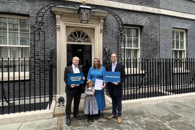 Helen and Peter Blythe (right) and Etta at 10 Downing Street. Etta is holding Benedict's favourite toy monkey Ray.