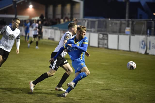 Connor Kennedy (blue) in action for Peterborough Sports against Scarborough Athletic. Photo: David Lowndes.