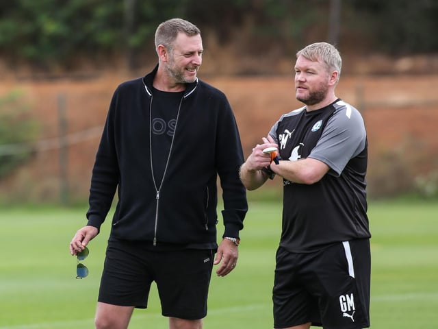 Posh chairman Darragh MacAnthony with manager Grant McCann.