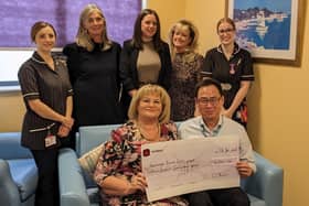 Fundraiser Carol Collier presents the donation to North West Anglia NHS Foundation Trust Consultant Stephen Goh along with members of the Breast Care team (Marie Rosella and Nikita Copestake), event co-organiser Christine Brown, Jen Woolmer from Holiday Inn Peterborough West and Colleen Gostick from Buckles Solicitors.