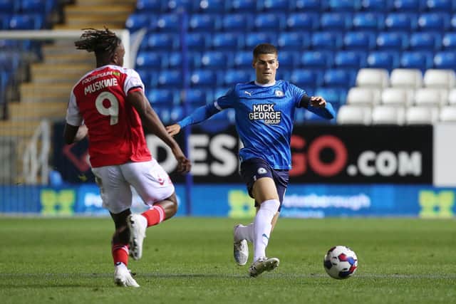 Posh defender Ronnie Edwards in action with Admiral Muskwe of Fleetwood Town. Photo: Joe Dent/theposh.com.