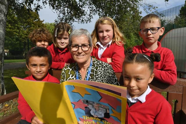 Braybrook teaching assistant Sharron Beeby retires after 35 years at the school -  pictured with some of the pupils she taught.
